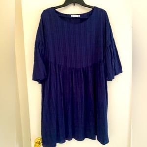 Navy blue lace dress with pockets.